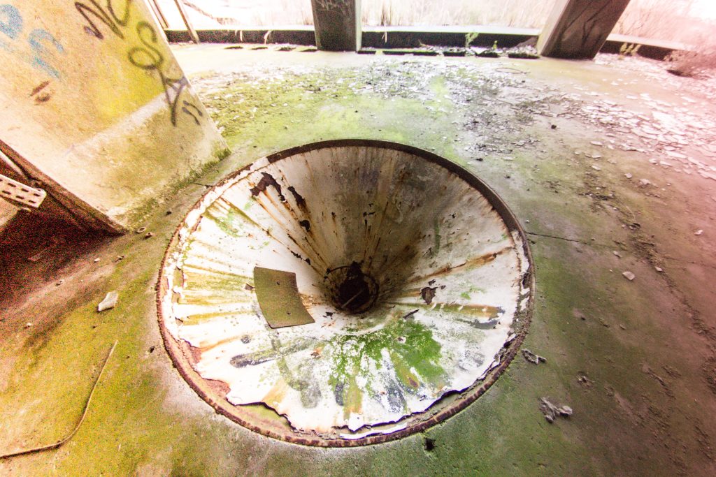 Abandoned France: Drain Hole — Urban Exploration Stock Photo